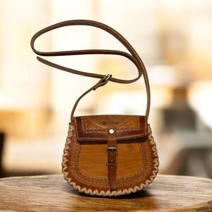 Leather Crossbody Handmade coin purse made of pressed and embossed leather.